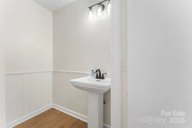 a view of a room with wooden floor and chair