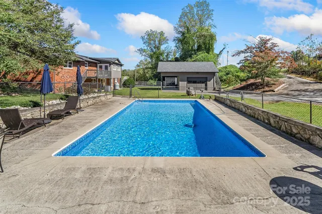 a view of a backyard with sitting area