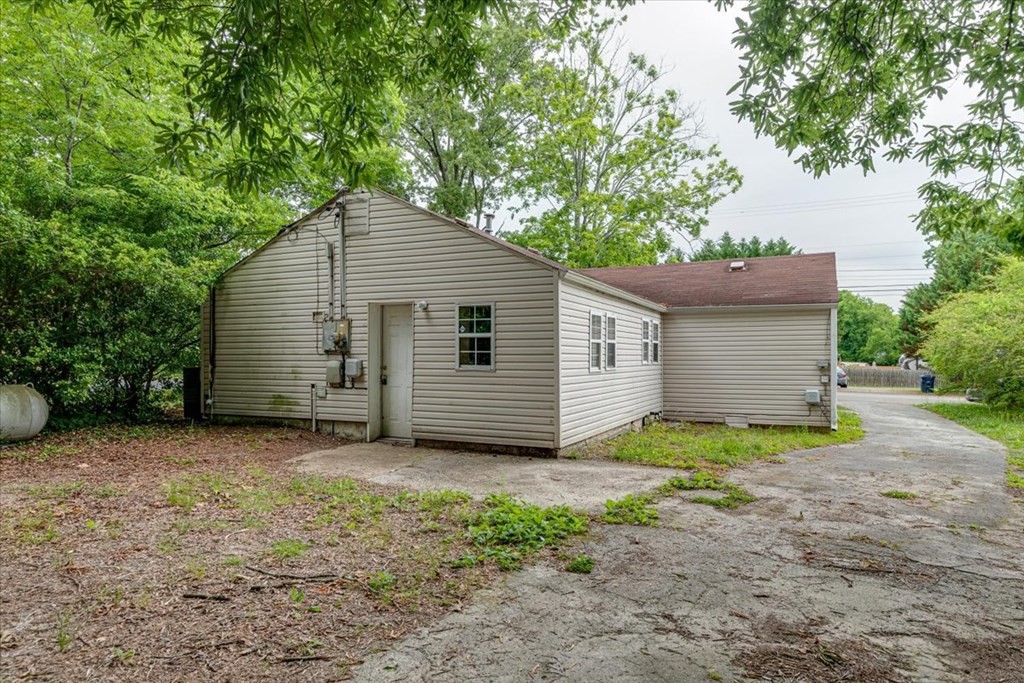 146 State Line Road Rossville, GA 30741 - Photo 17 of 18 a view of a house with a small yard and a large tree