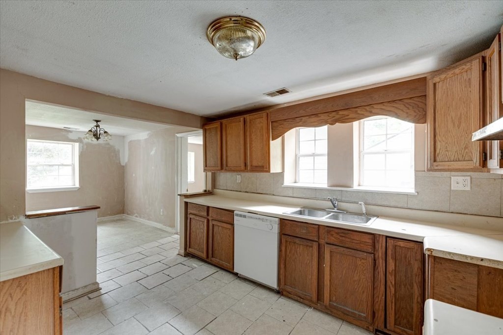 146 State Line Road Rossville, GA 30741 - Photo 8 of 18 a kitchen with a sink cabinets and window