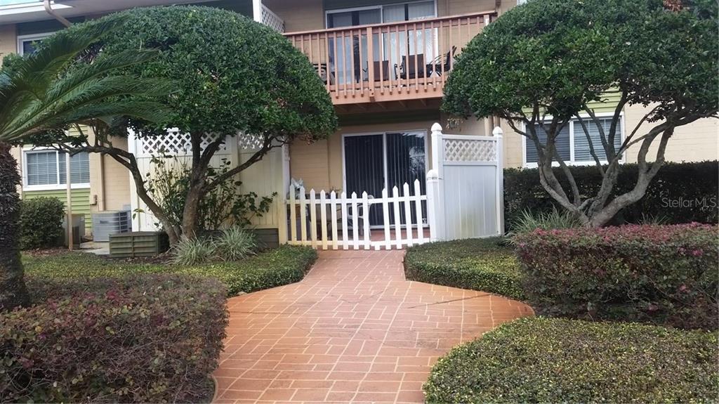 1695 Lee Road, Unit A105 Winter Park, FL 32789 - Photo 1 of 1 a front view of a house with garden