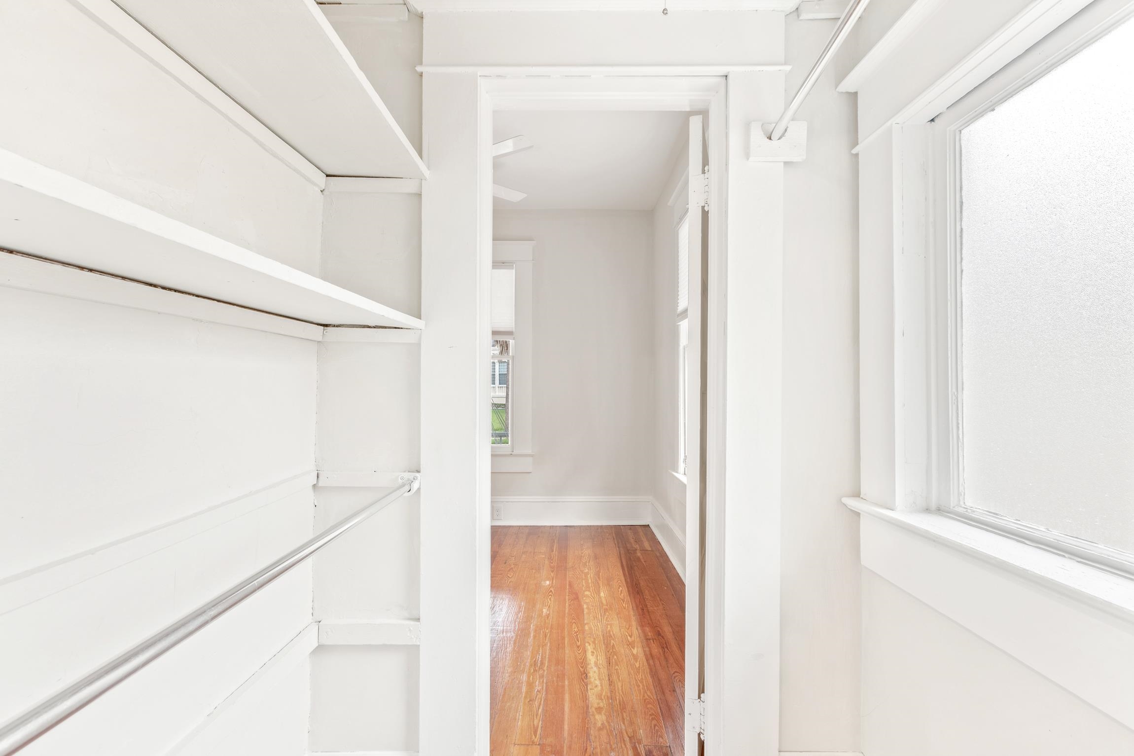 11 Hildreth Drive St. Augustine, FL 32084 - Photo 22 of 42 a view of a hallway with wooden floor and staircase