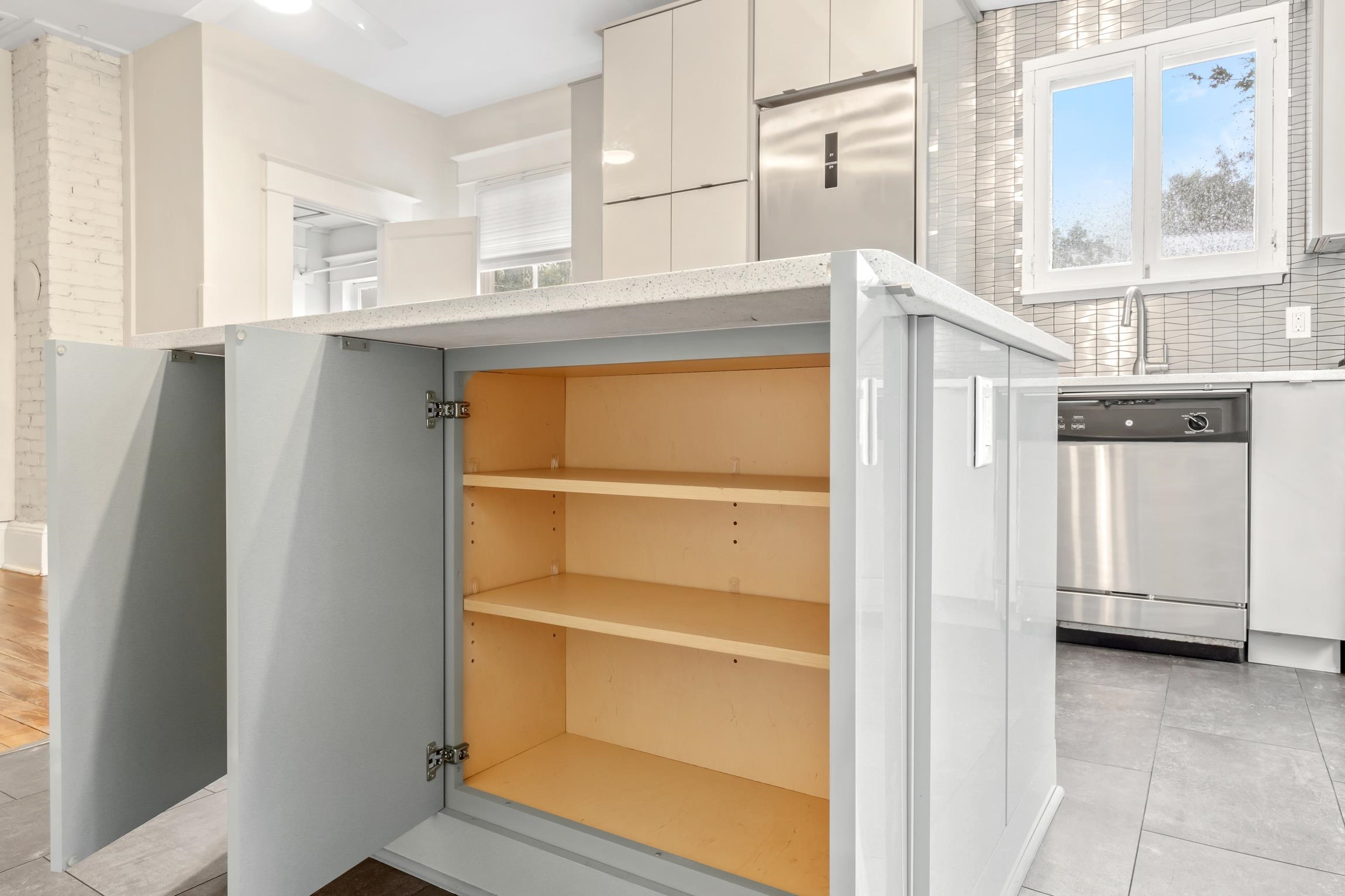 11 Hildreth Drive St. Augustine, FL 32084 - Photo 10 of 42 a kitchen with white cabinets and a refrigerator