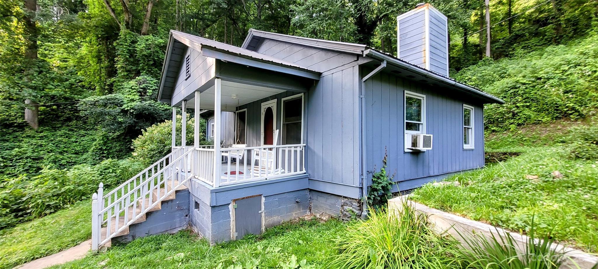 6115 Skyland Drive Sylva, NC 28779 - Photo 2 of 15 front view of house with a yard