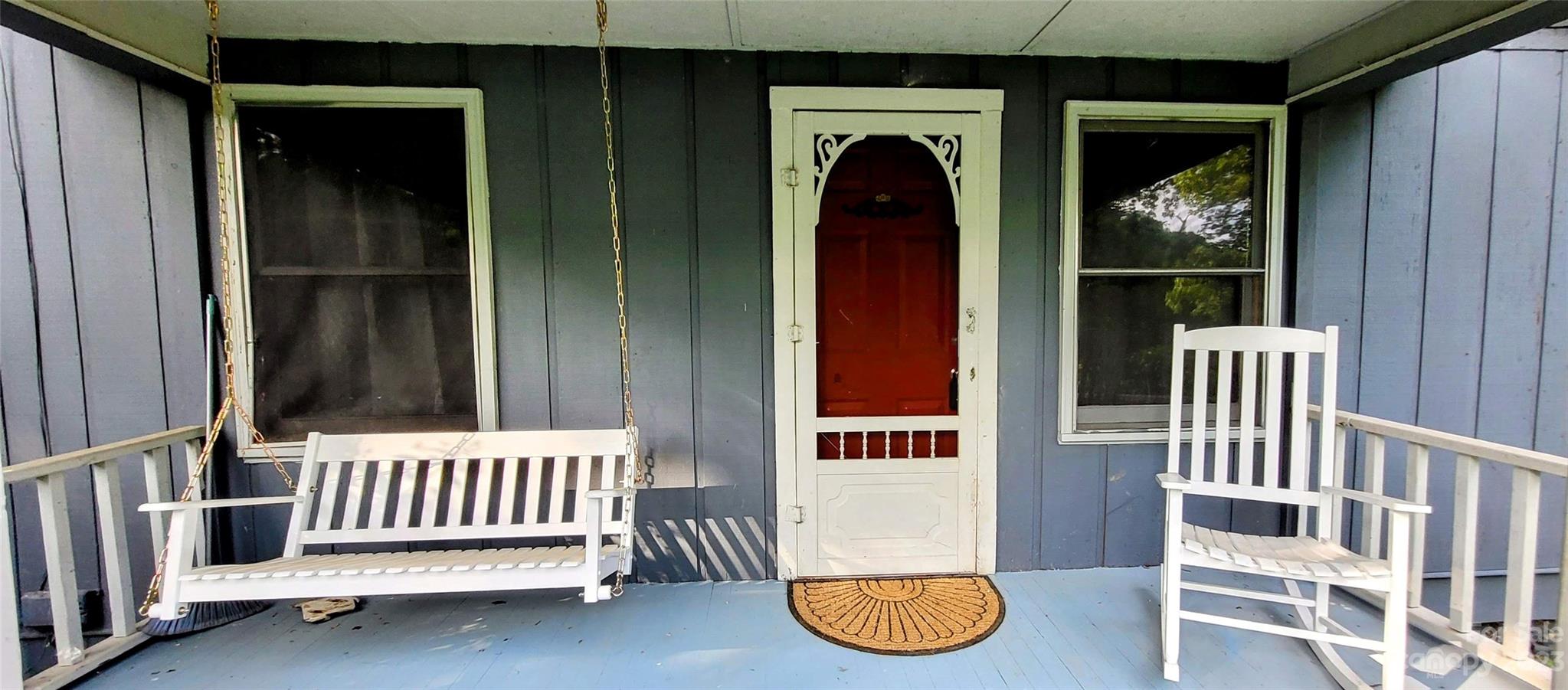 6115 Skyland Drive Sylva, NC 28779 - Photo 5 of 15 a view of a porch with a door