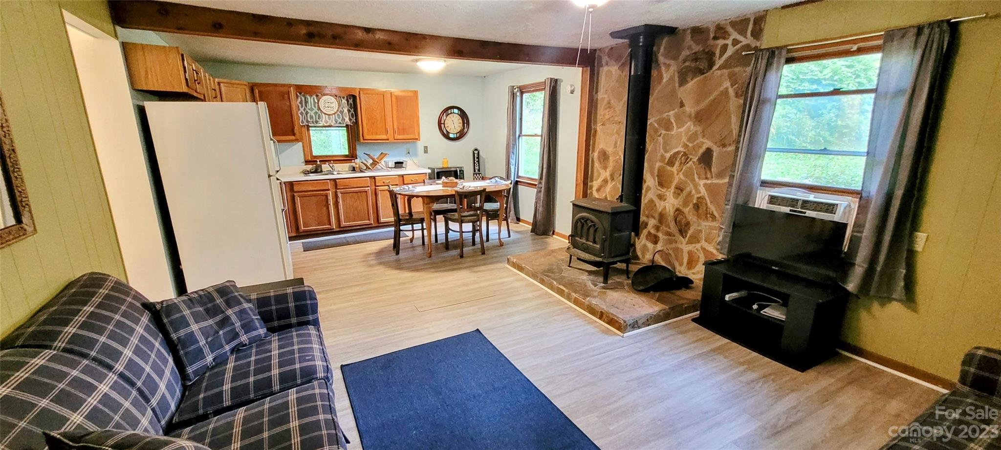 6115 Skyland Drive Sylva, NC 28779 - Photo 10 of 15 a living room with furniture and a flat screen tv