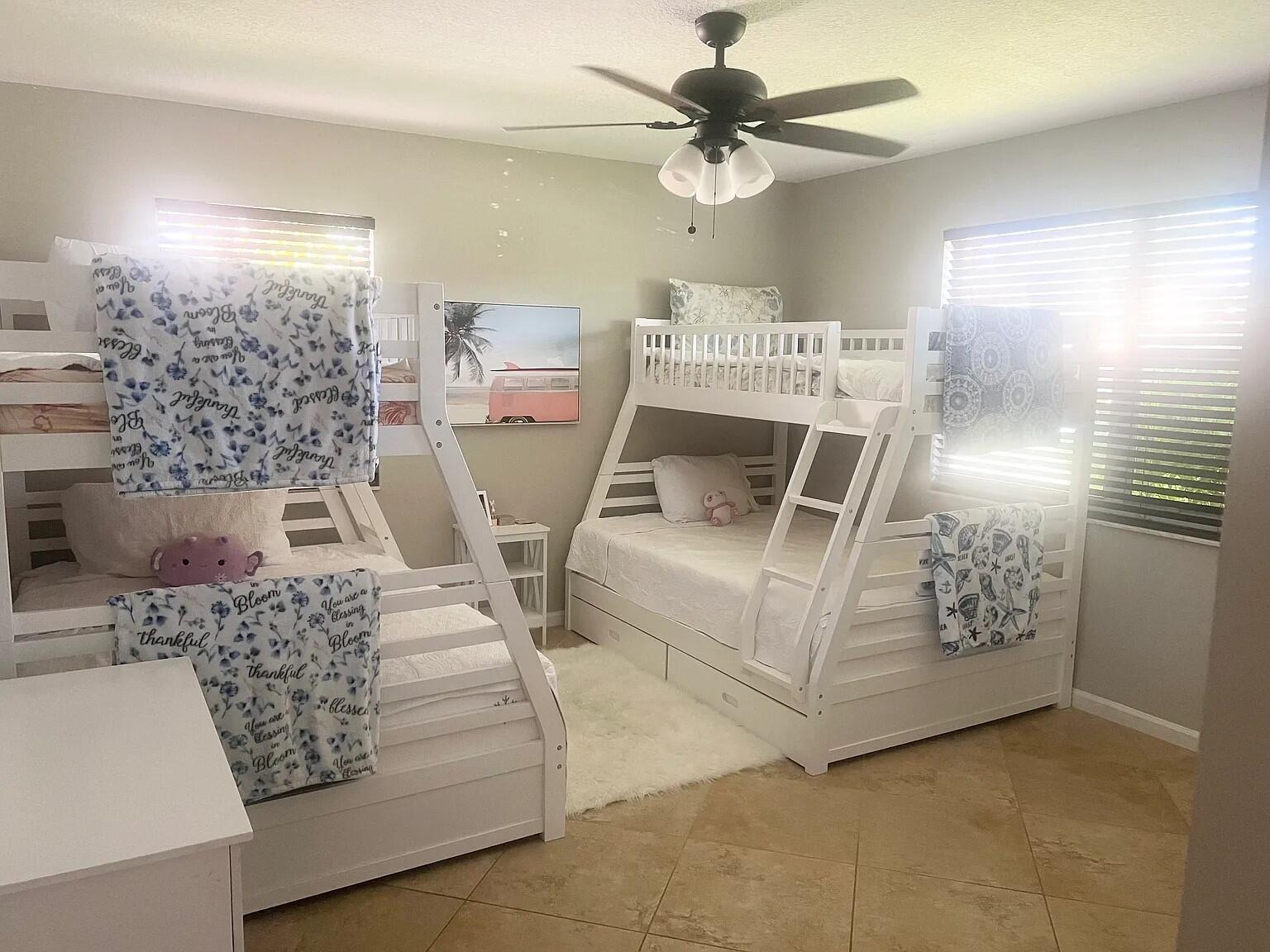 6435 Foster Street Jupiter, FL 33458 - Photo 7 of 8 a living room with furniture and a chandelier