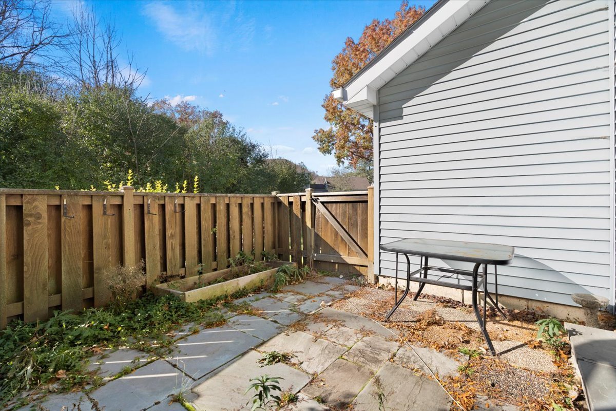 8 Hastings Lane Lincolnshire, IL 60069 - Photo 28 of 29 a view of a backyard with a chair and potted plants