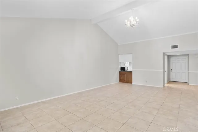 a view of a kitchen with a sink and a chandelier