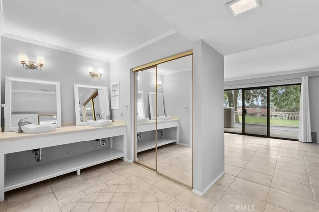 a bathroom with a granite countertop sink toilet a mirror and shower