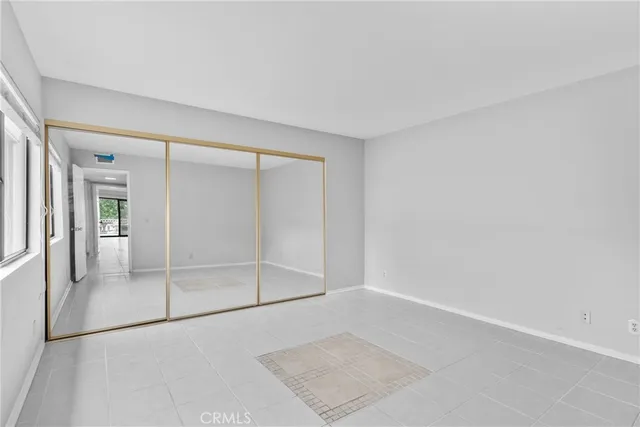 a view of a house with backyard and glass windows