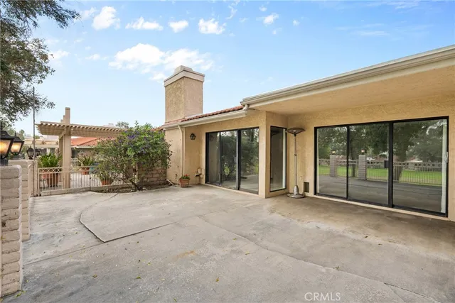a view of a yard with large trees