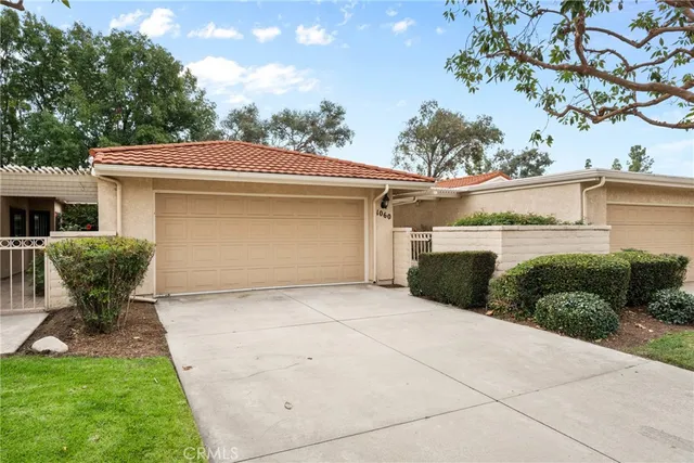 a view of a patio with table and chairs with a fire pit