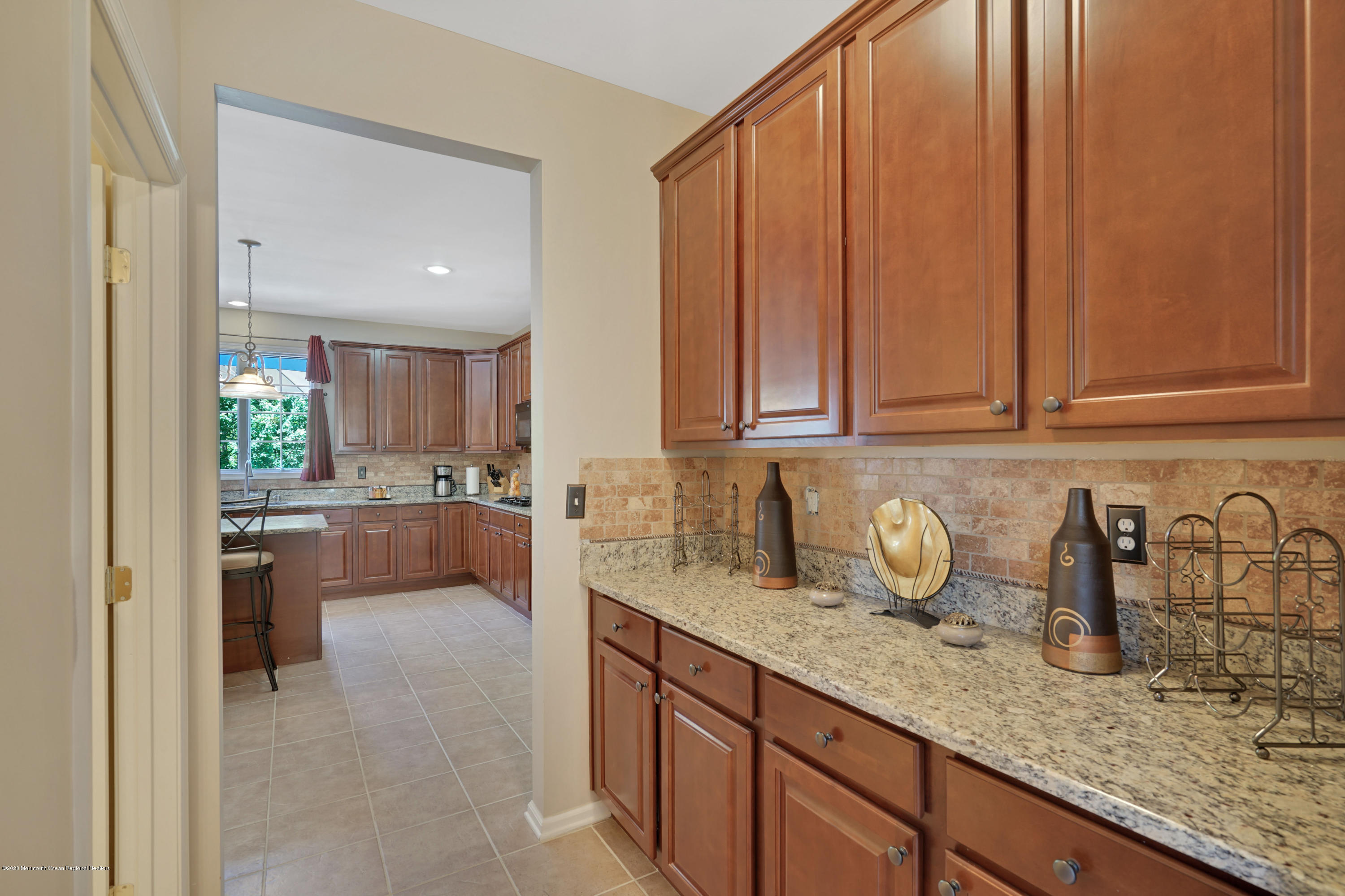 27 Northwoods Road Asbury Park, NJ 07712 - Photo 16 of 76 a kitchen with sink and cabinets