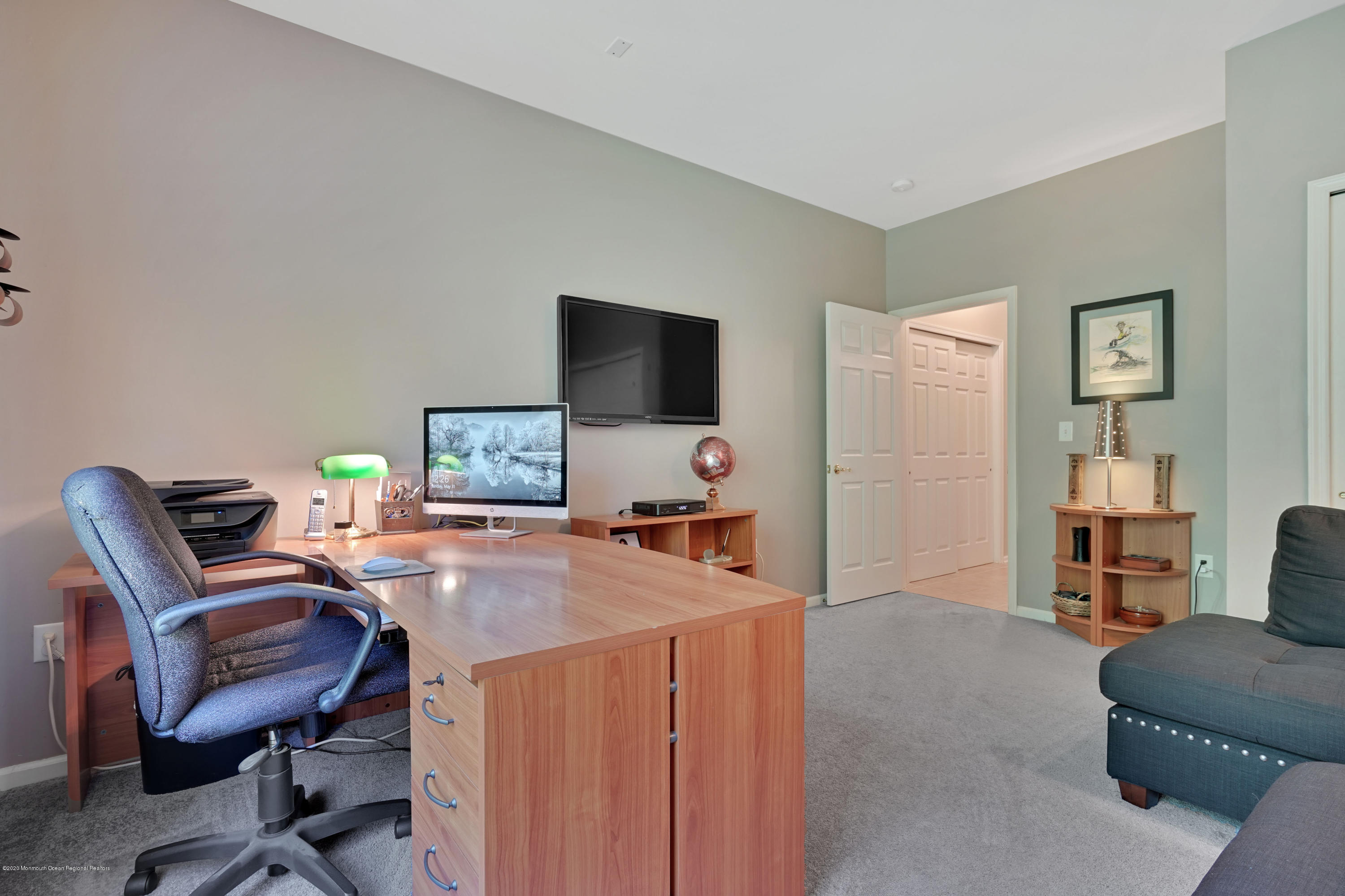 27 Northwoods Road Asbury Park, NJ 07712 - Photo 27 of 76 a workspace with furniture and a flat screen tv