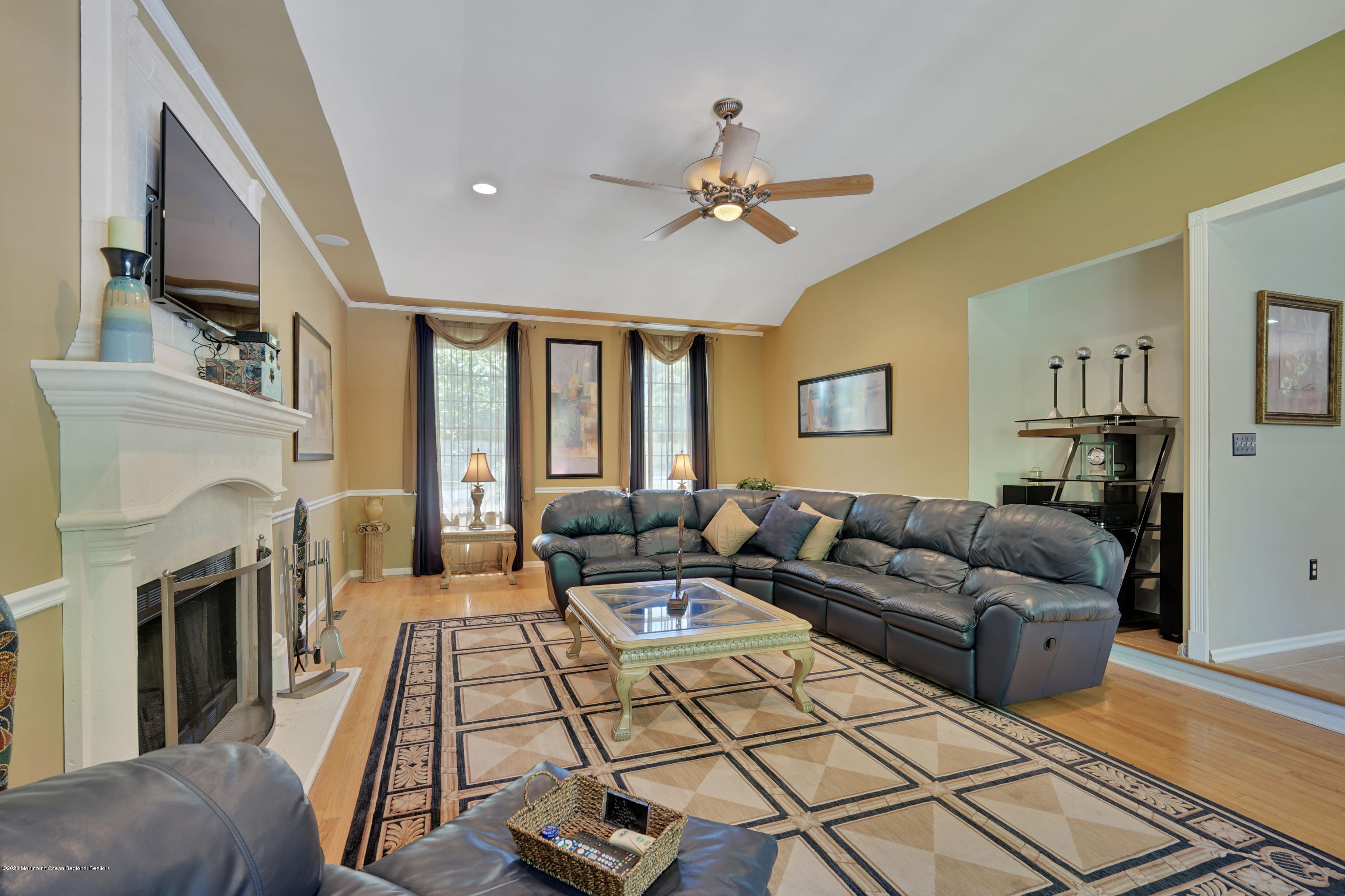 27 Northwoods Road Asbury Park, NJ 07712 - Photo 29 of 76 a living room with furniture fireplace and a flat screen tv
