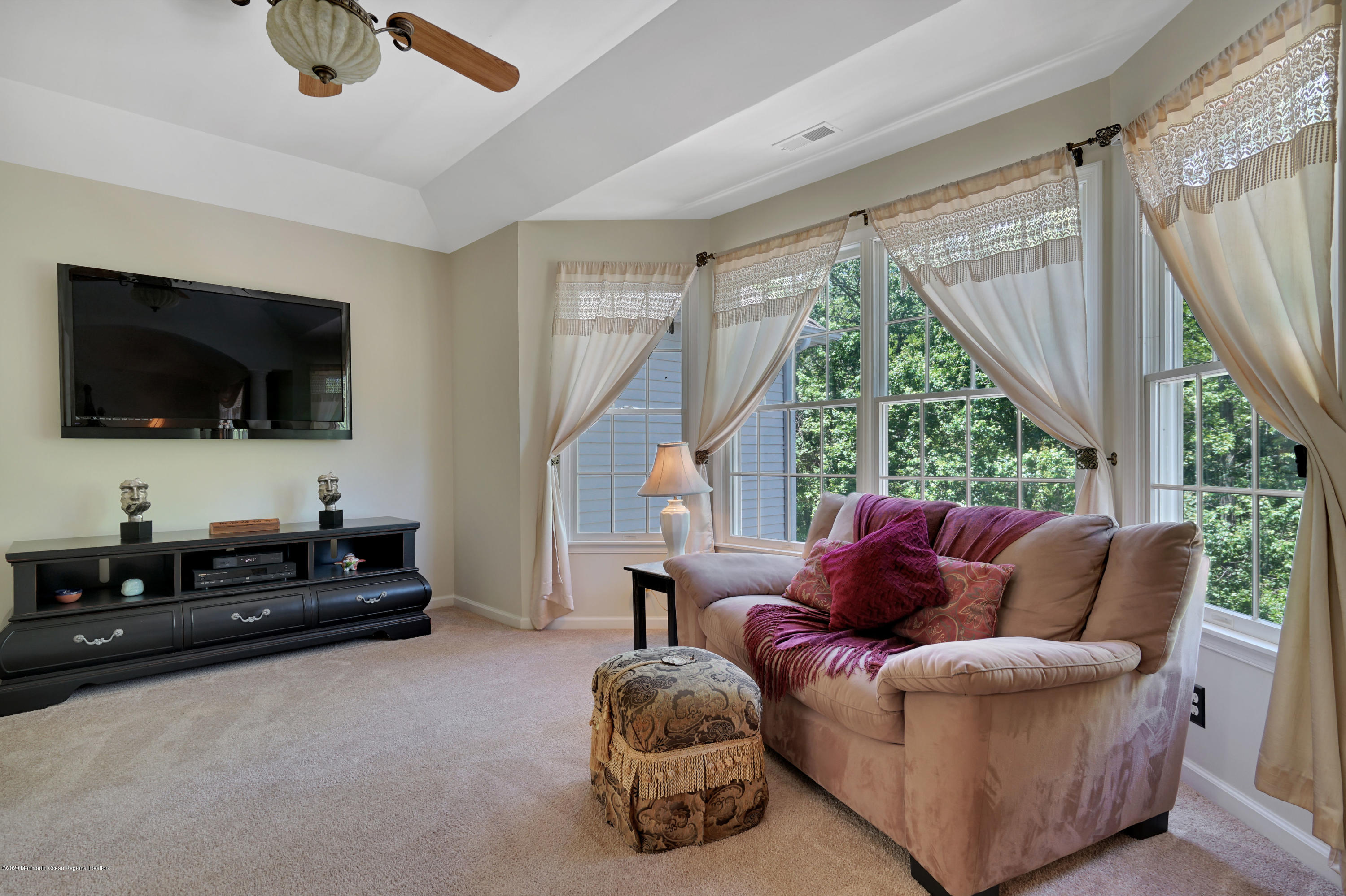27 Northwoods Road Asbury Park, NJ 07712 - Photo 35 of 76 a living room with furniture a flat screen tv and a large window