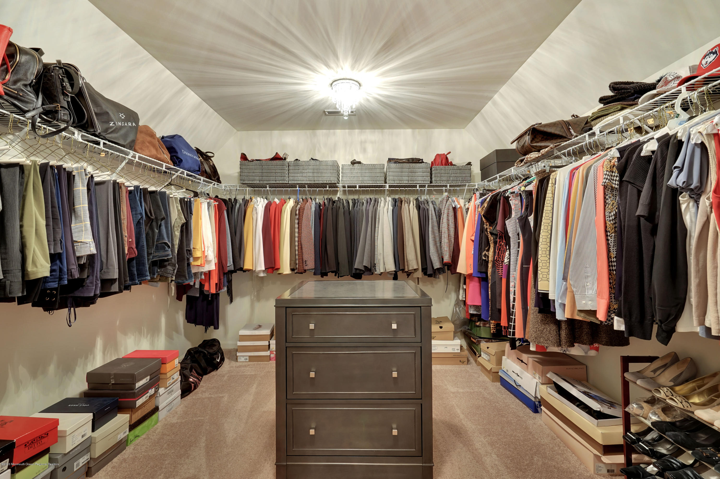 27 Northwoods Road Asbury Park, NJ 07712 - Photo 46 of 76 a view of walk in closet with clothes and shoes