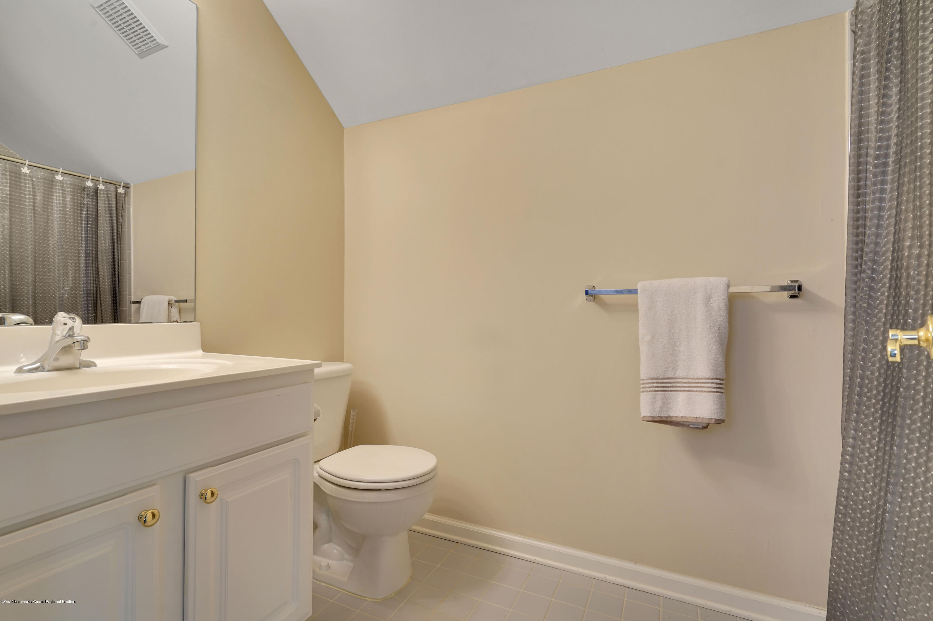 27 Northwoods Road Asbury Park, NJ 07712 - Photo 50 of 76 a bathroom with a sink a toilet and mirror