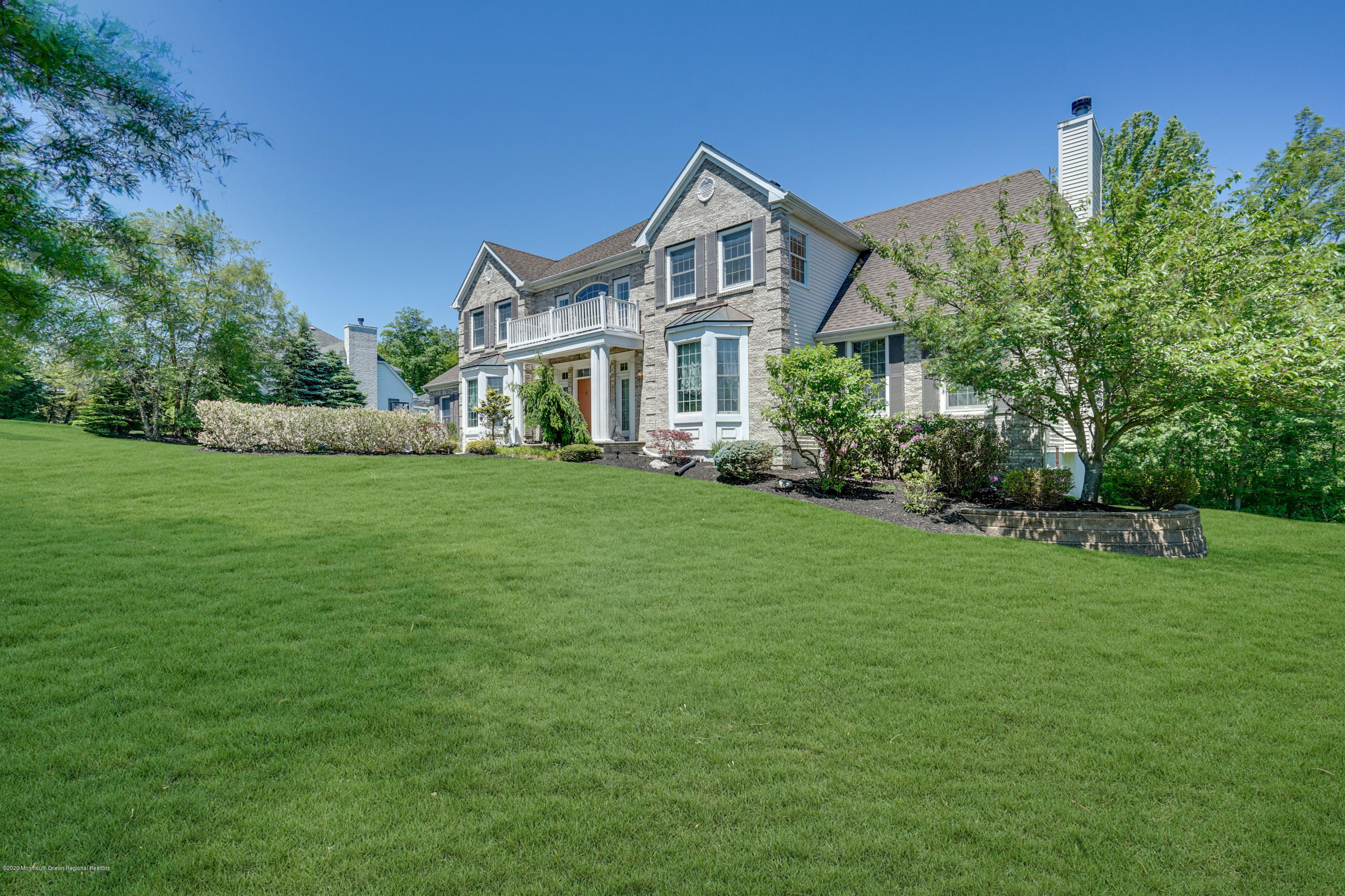 27 Northwoods Road Asbury Park, NJ 07712 - Photo 5 of 76 a front view of a house with a garden