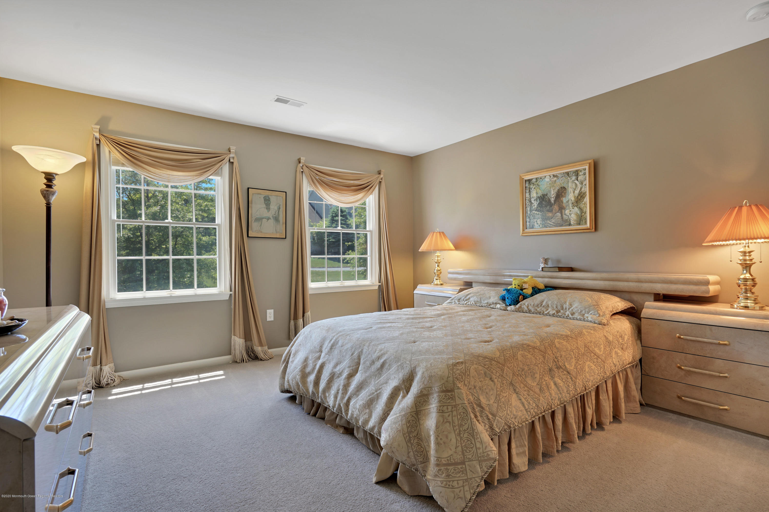 27 Northwoods Road Asbury Park, NJ 07712 - Photo 53 of 76 a spacious bedroom with a bed and glass door