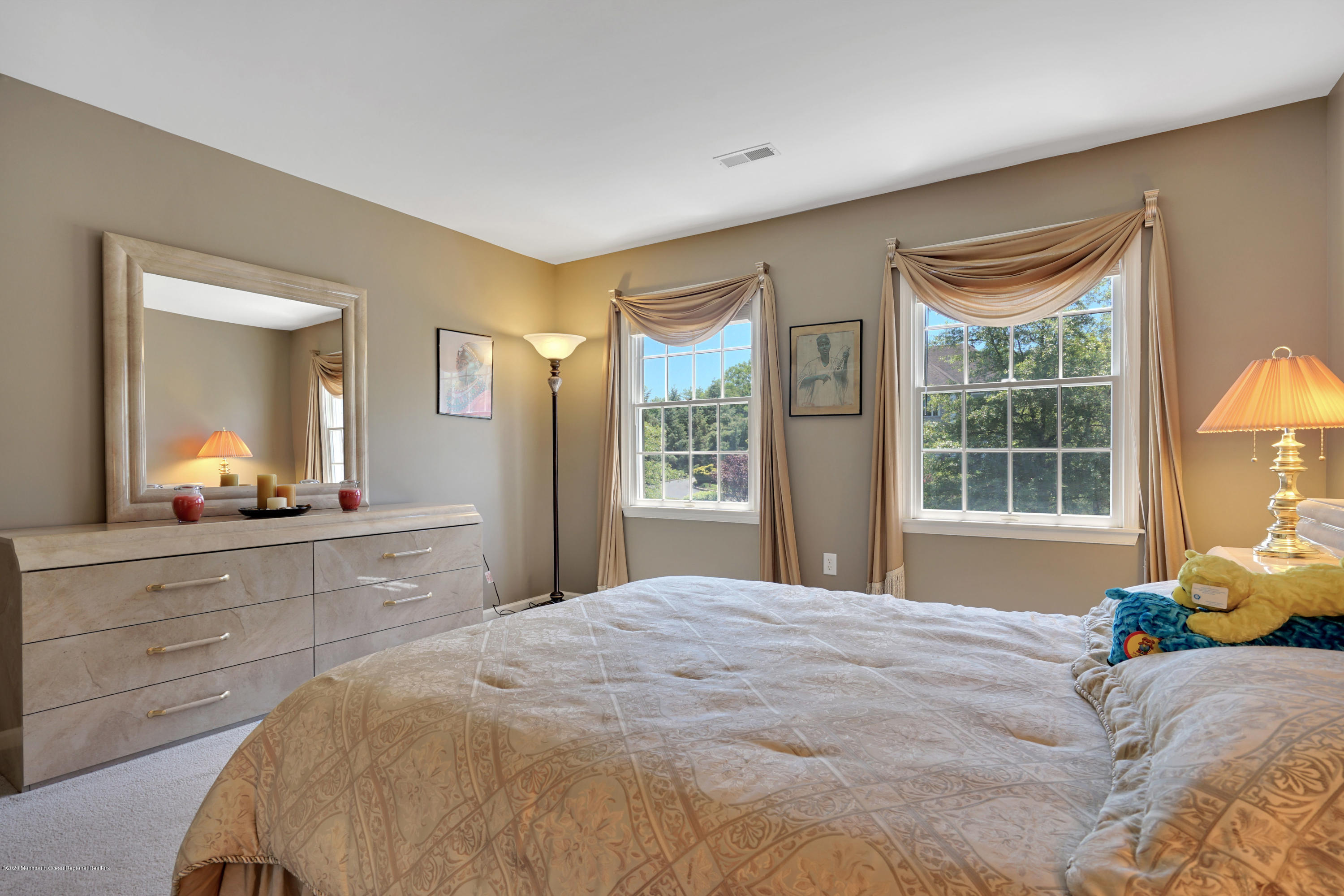 27 Northwoods Road Asbury Park, NJ 07712 - Photo 56 of 76 a bedroom with a bed and a dresser next to a window