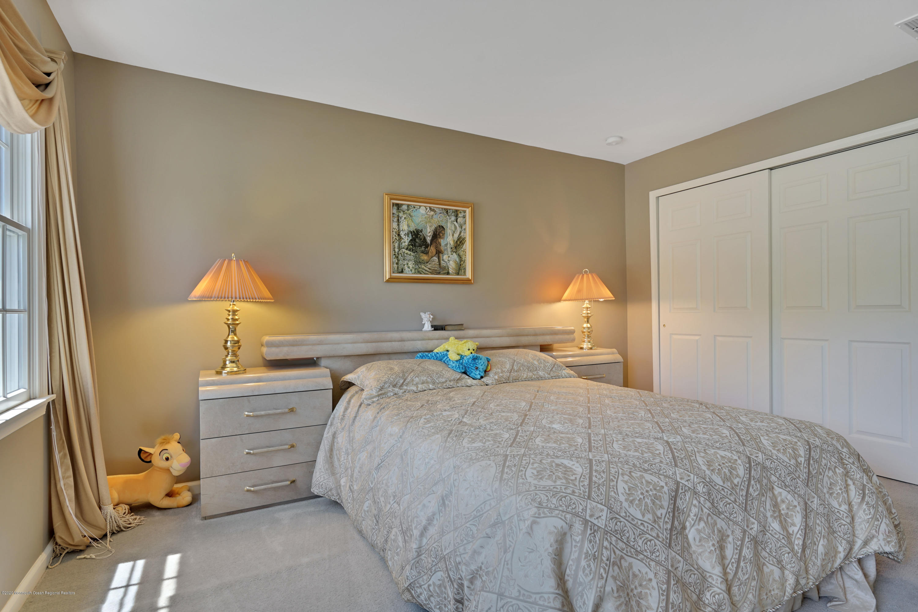 27 Northwoods Road Asbury Park, NJ 07712 - Photo 57 of 76 a bedroom with a bed and a window