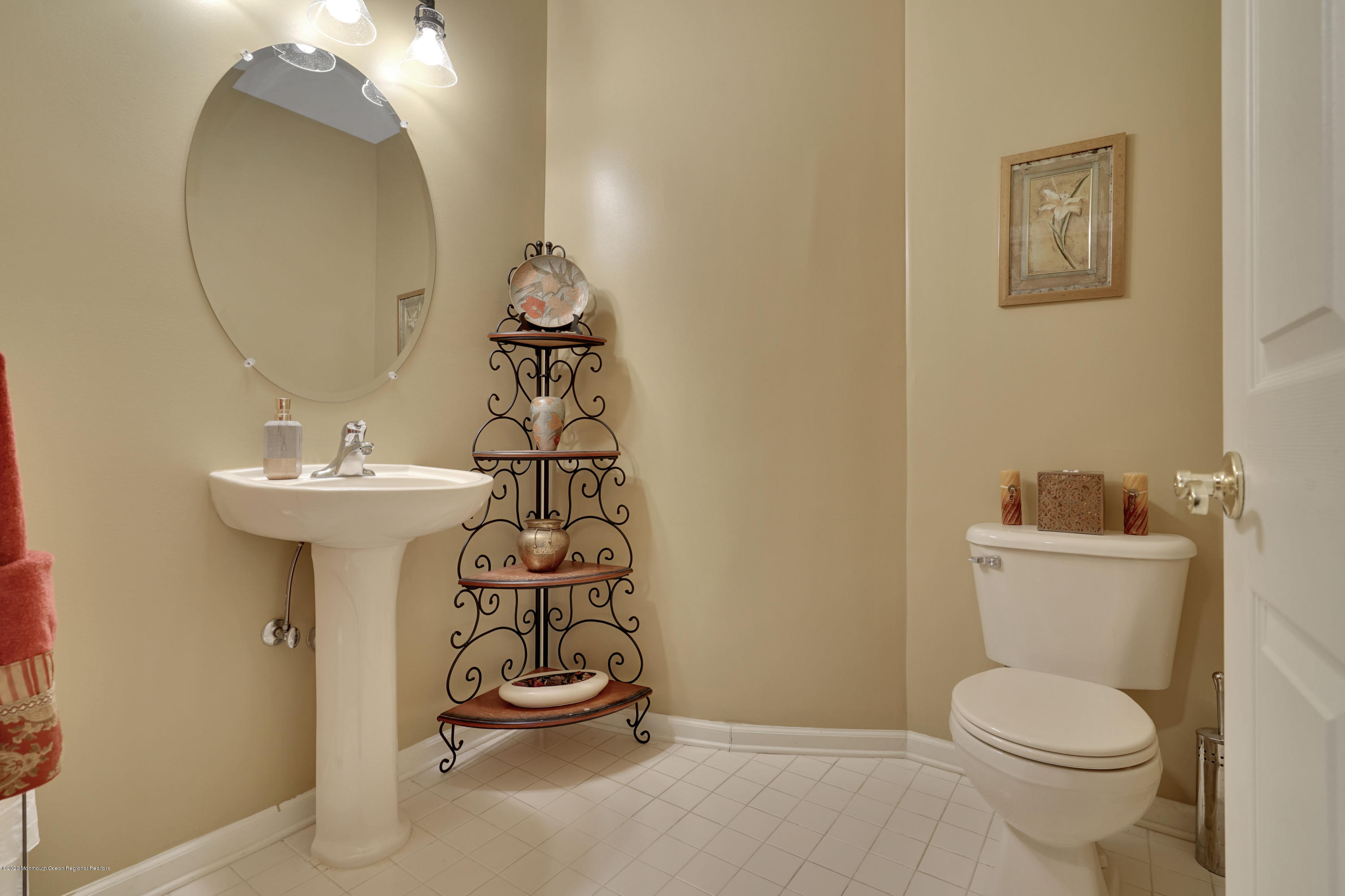 27 Northwoods Road Asbury Park, NJ 07712 - Photo 58 of 76 a bathroom with a sink toilet and a mirror