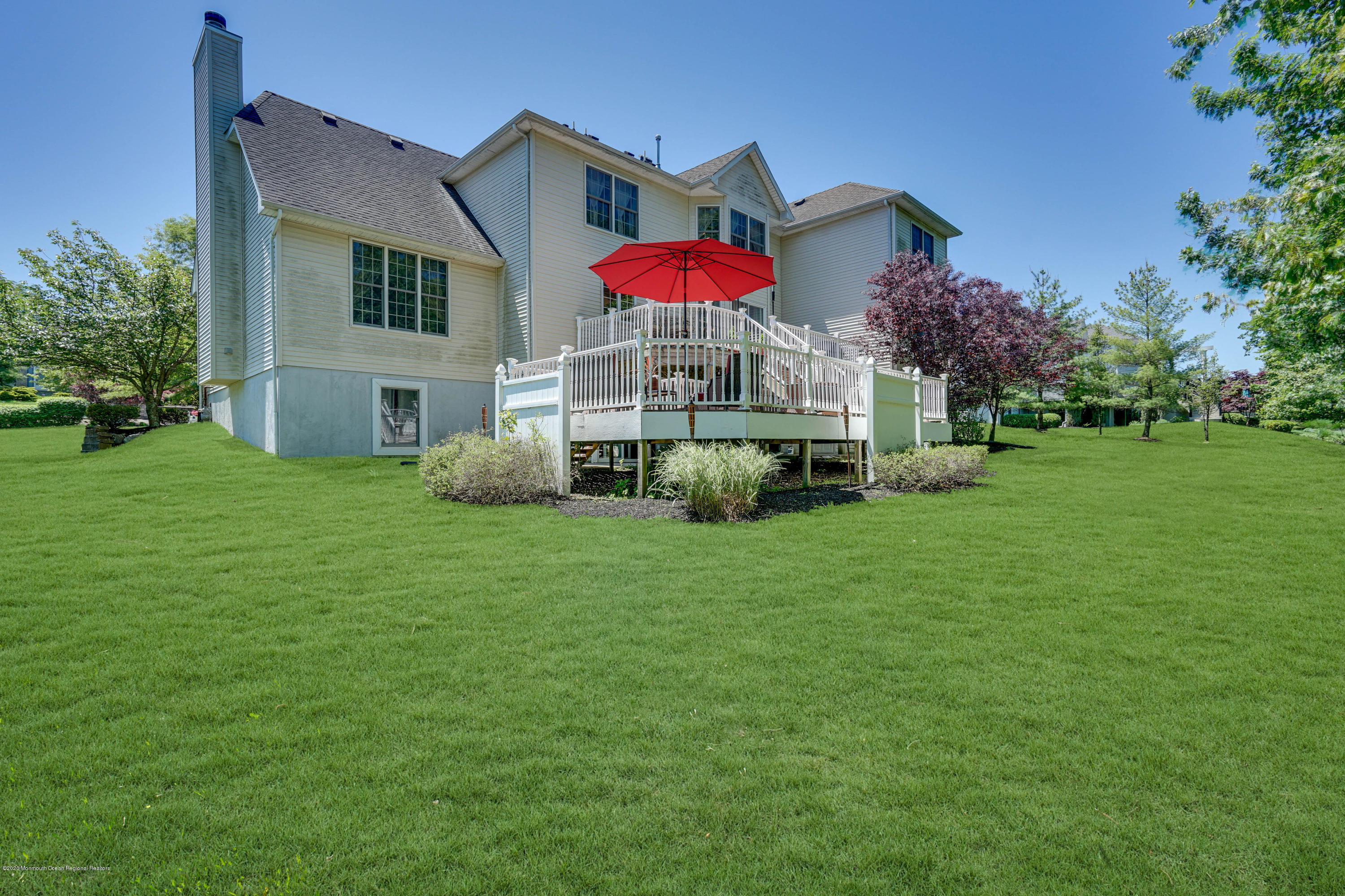 27 Northwoods Road Asbury Park, NJ 07712 - Photo 68 of 76 a front view of house with yard and trees