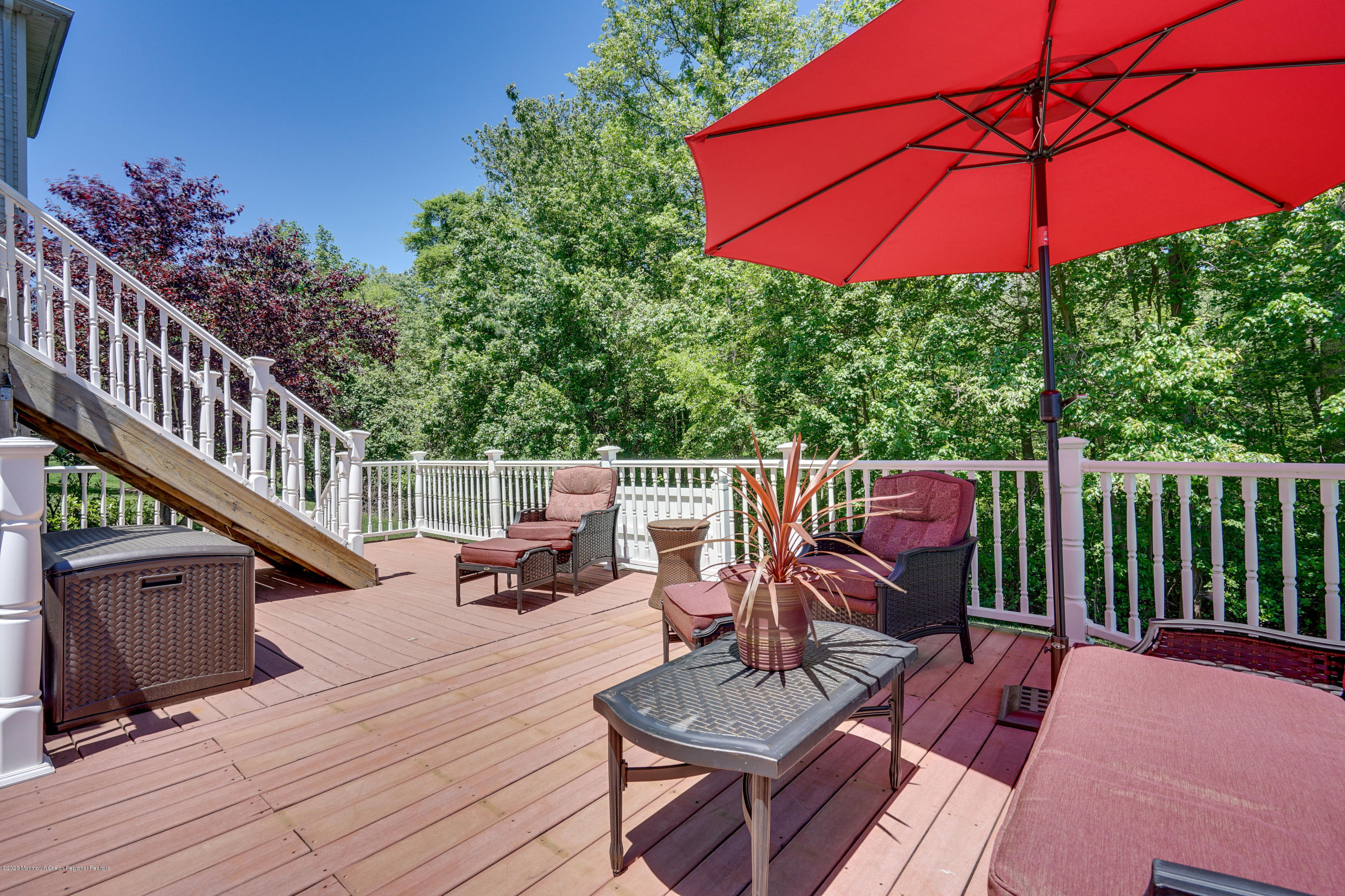 27 Northwoods Road Asbury Park, NJ 07712 - Photo 69 of 76 a view of balcony with outdoor seating and wooden floor