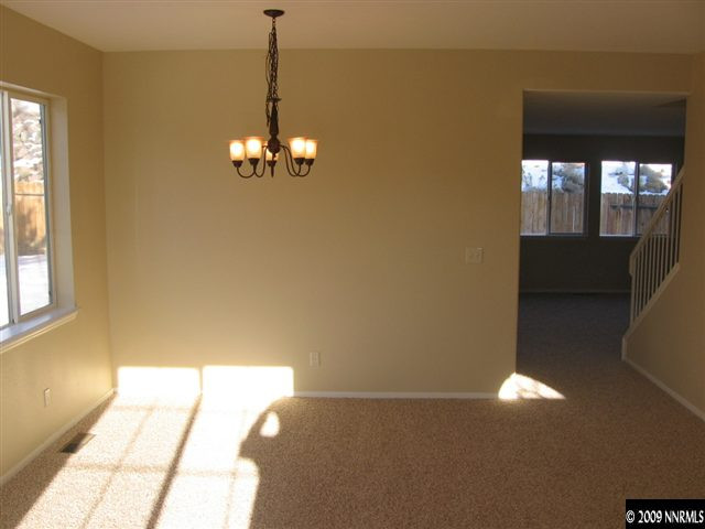 2570 Rio Rico Court Reno, NV 89523 - Photo 3 of 9 a view of a room with windows and chandelier