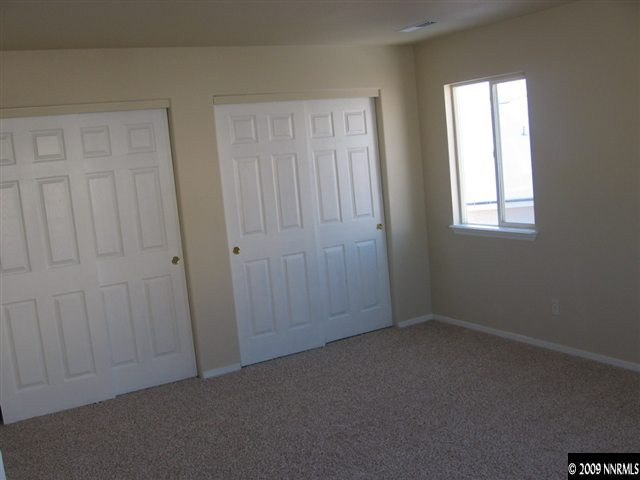 2570 Rio Rico Court Reno, NV 89523 - Photo 7 of 9 an empty room with windows