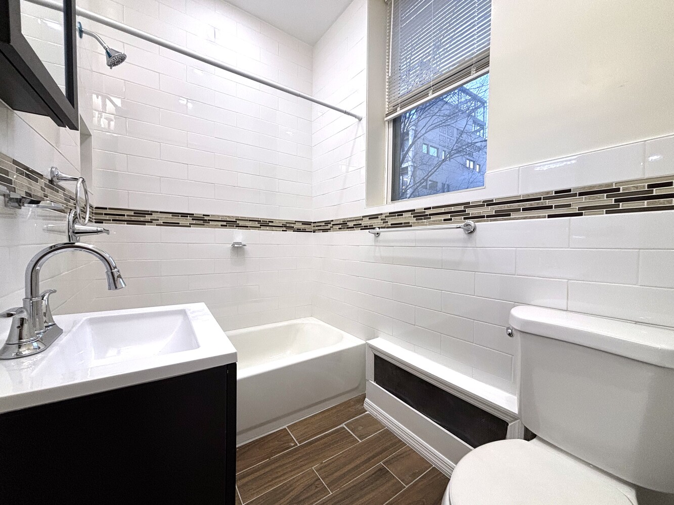 511 West 142nd Street, Unit 5 Manhattan, NY 10031 - Photo 5 of 5 a bathroom with a sink toilet and shower