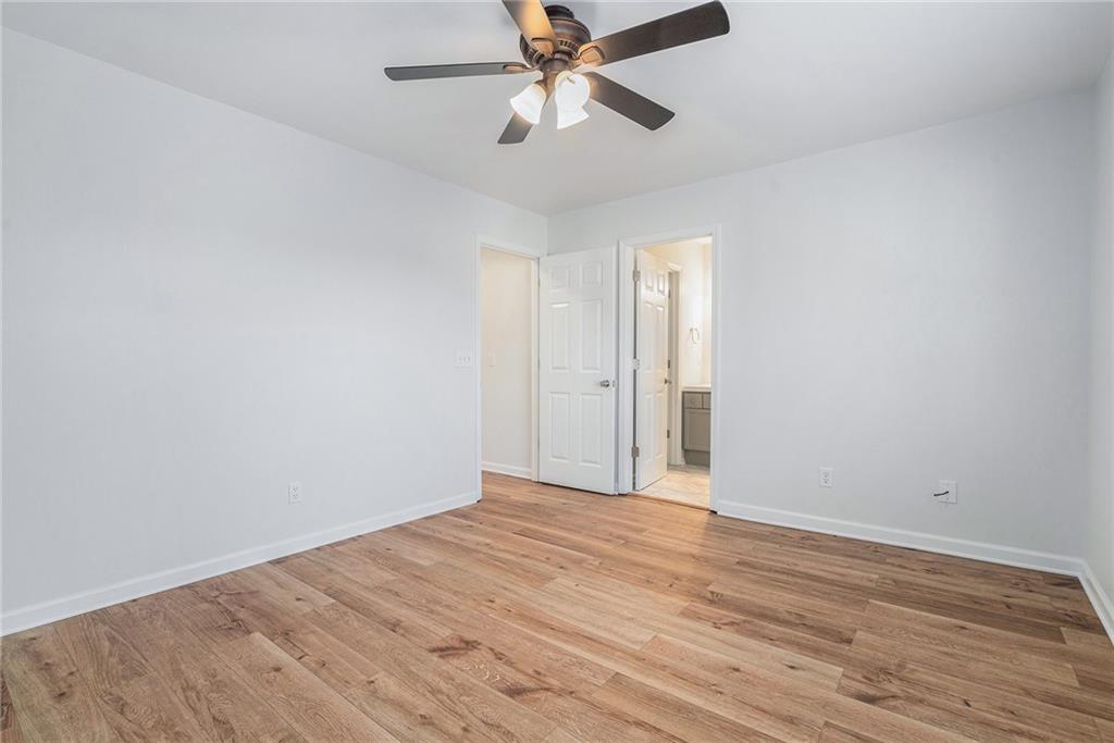 244 Windcroft Circle Northwest Acworth, GA 30101 - Photo 12 of 18 a view of empty room with wooden floor