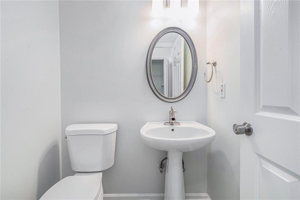 244 Windcroft Circle Northwest Acworth, GA 30101 - Photo 9 of 18 a bathroom with a sink a mirror and toilet