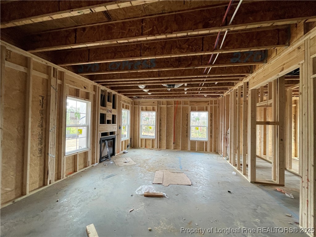 5036 Boxcut Lane Hope Mills, NC 28348 - Photo 5 of 15 a view of an empty room with a fireplace and a window