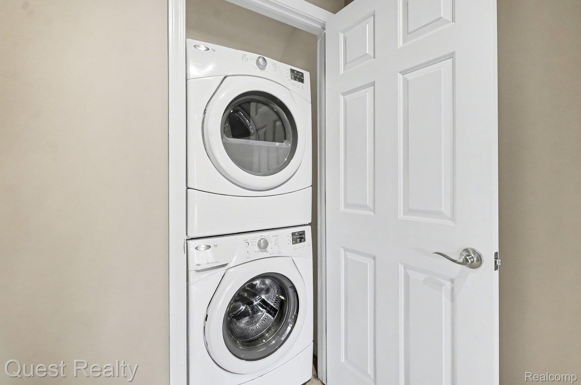 218 Mill Street Rochester, MI 48307 - Photo 12 of 34 Laundry area with stacked washer / dryer