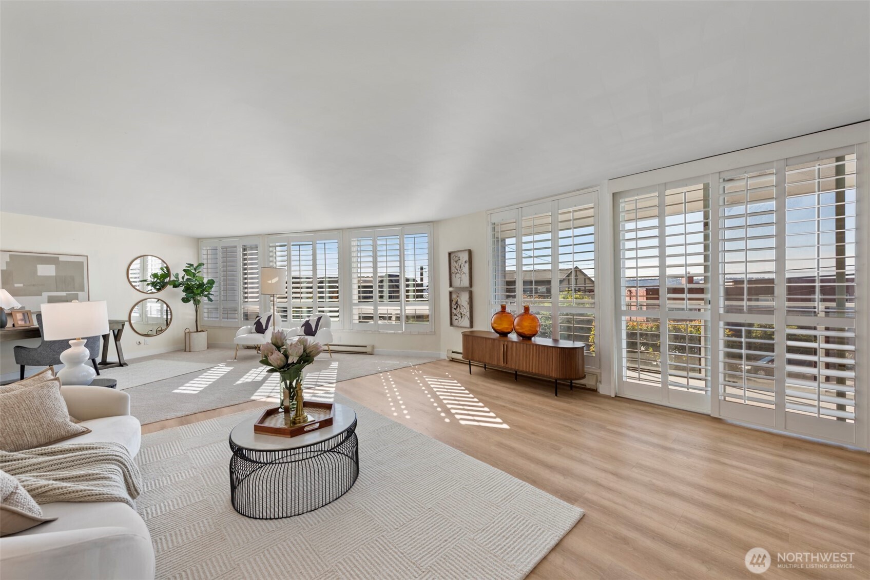 500 West Olympic Place, Unit 203 Seattle, WA 98119 - Photo 1 of 35 a living room with furniture and a large window