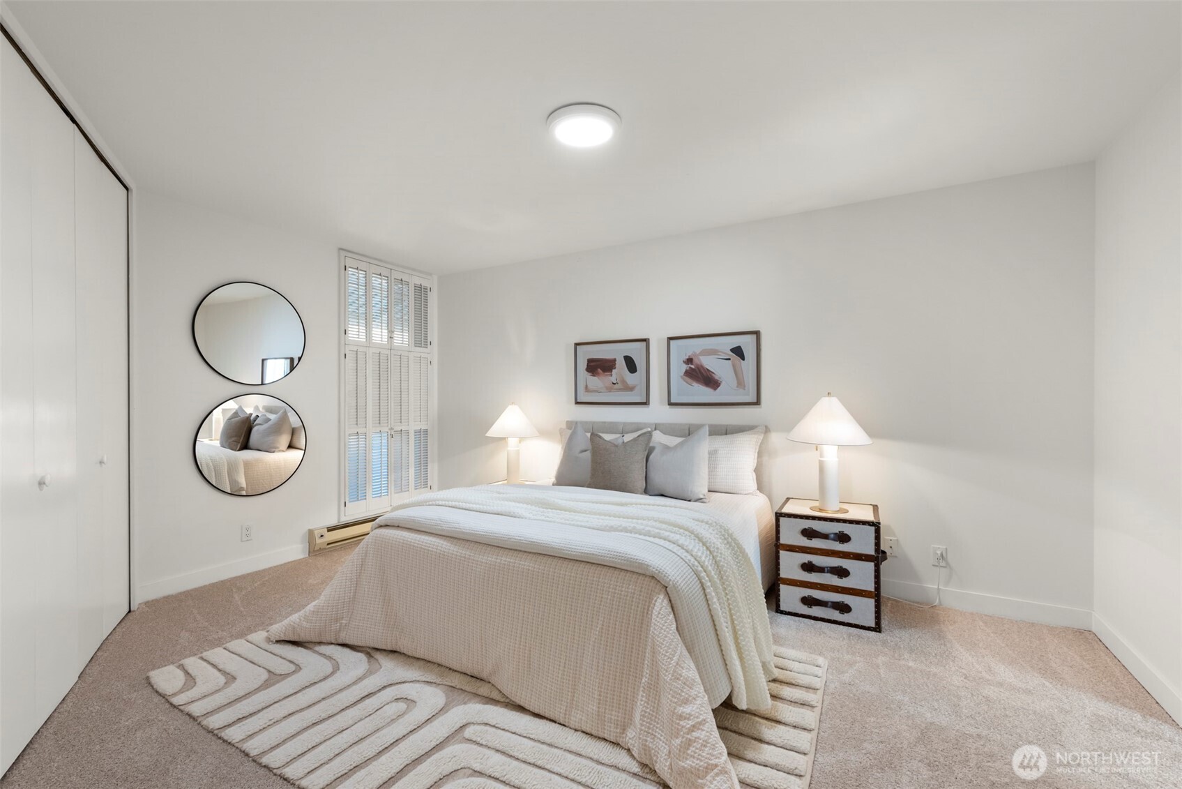 500 West Olympic Place, Unit 203 Seattle, WA 98119 - Photo 12 of 35 a bedroom with a bed and a lamp