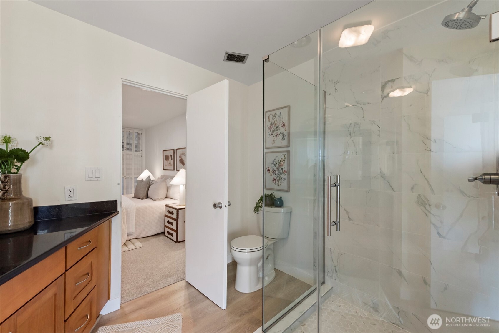 500 West Olympic Place, Unit 203 Seattle, WA 98119 - Photo 15 of 35 a spacious bathroom with a shower sink mirror and toilet