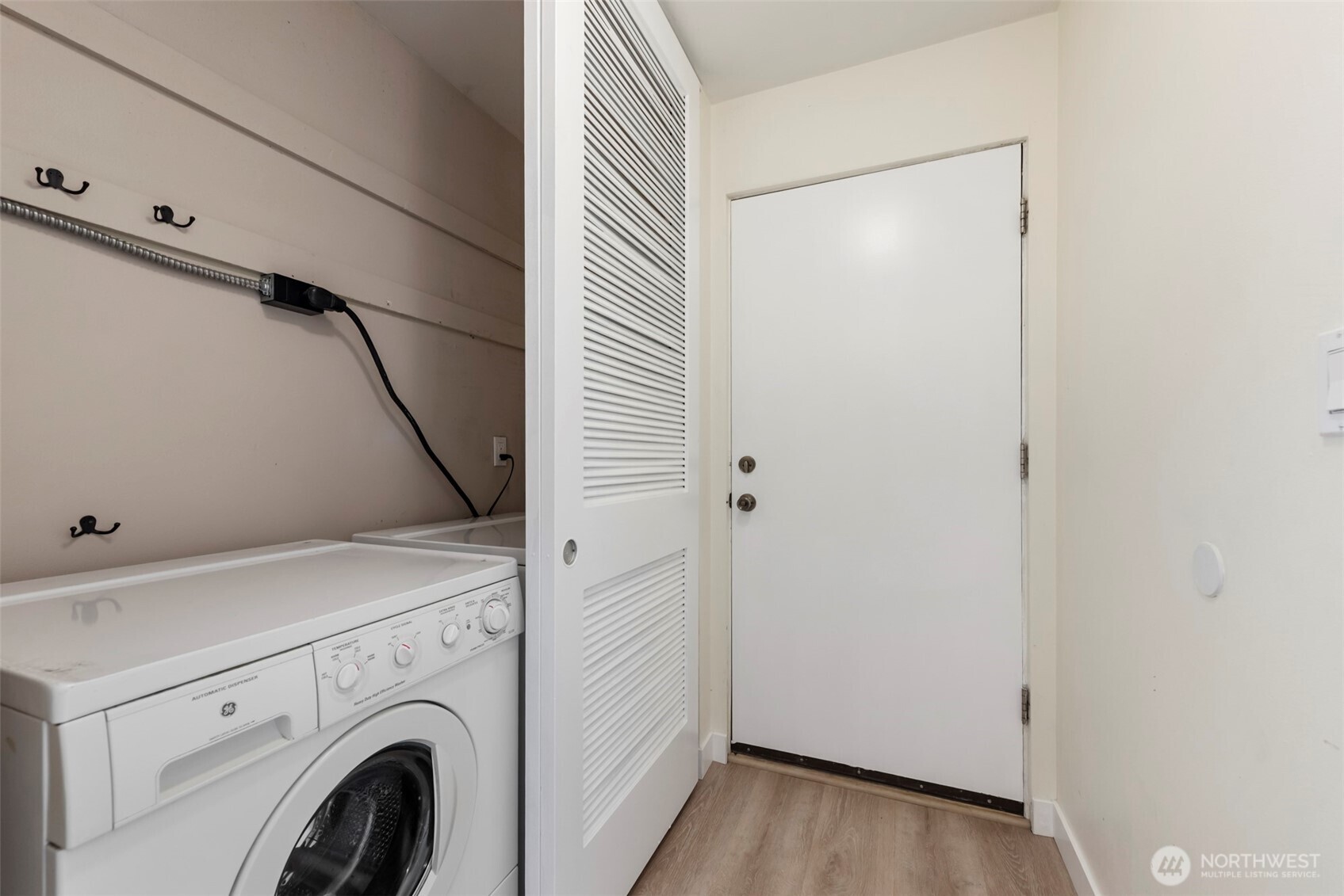 500 West Olympic Place, Unit 203 Seattle, WA 98119 - Photo 18 of 35 a utility room with dryer and washer