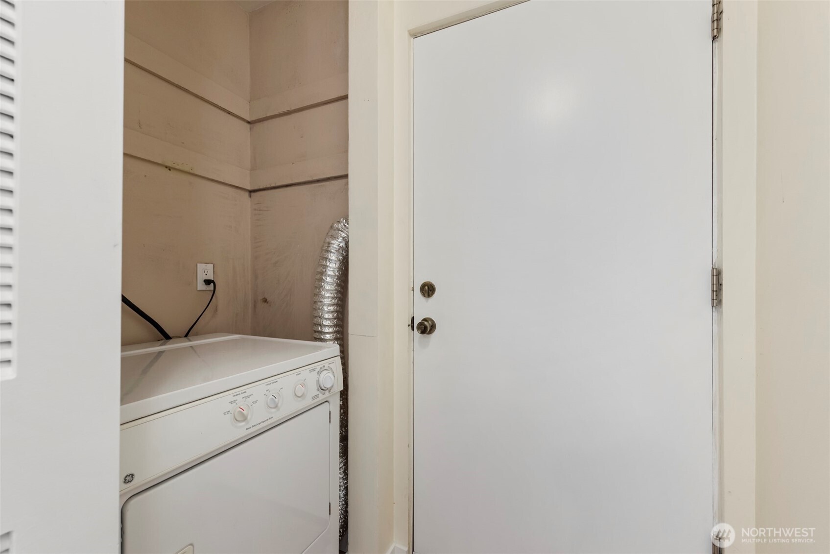 500 West Olympic Place, Unit 203 Seattle, WA 98119 - Photo 19 of 35 a utility room with dryer and washer