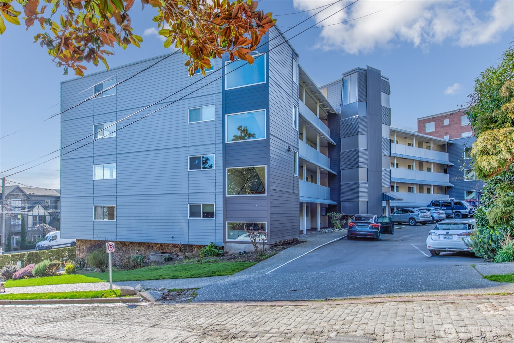 500 West Olympic Place, Unit 203 Seattle, WA 98119 - Photo 23 of 35 a view of a building with a yard
