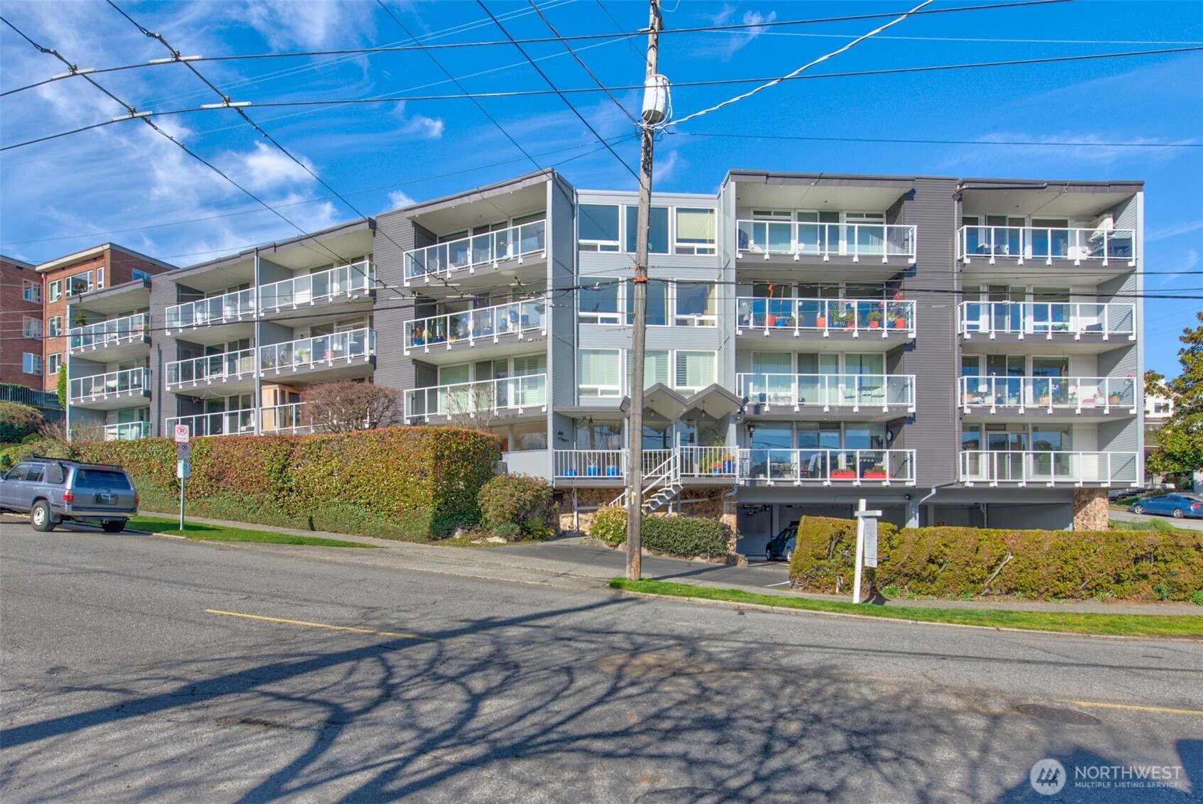 500 West Olympic Place, Unit 203 Seattle, WA 98119 - Photo 24 of 35 a view of a building with a street