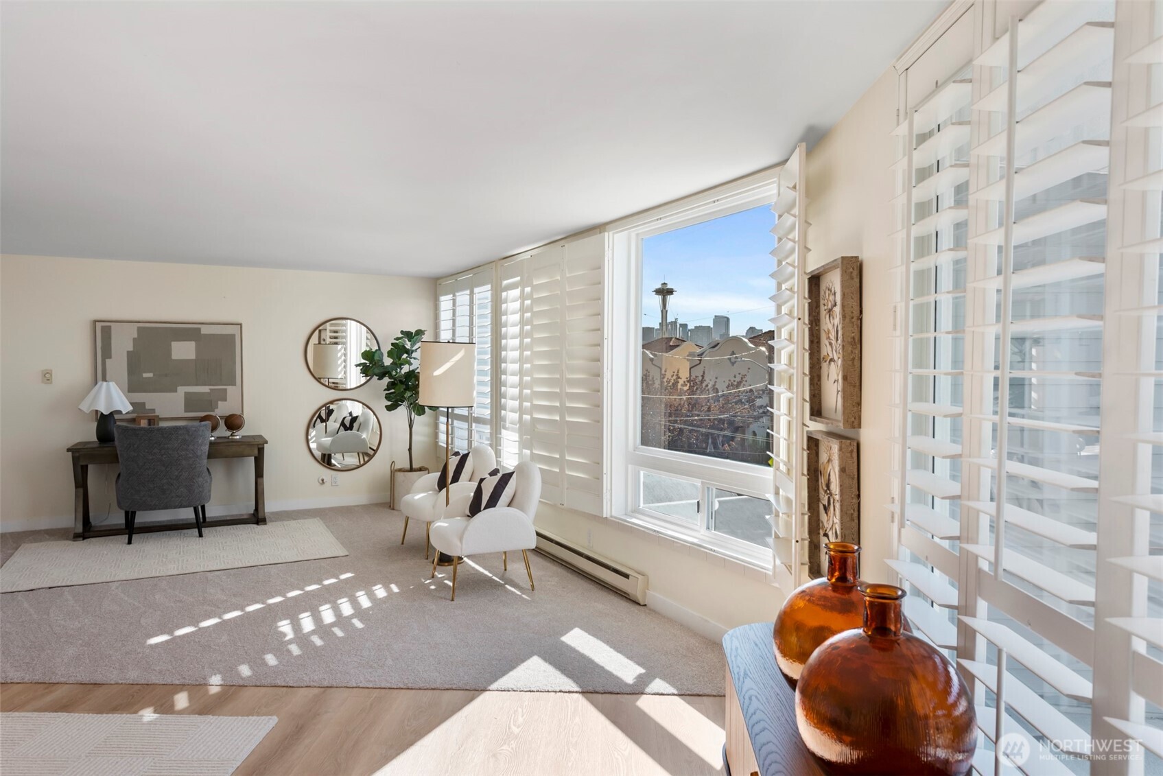 500 West Olympic Place, Unit 203 Seattle, WA 98119 - Photo 3 of 35 a living room with furniture and a large window