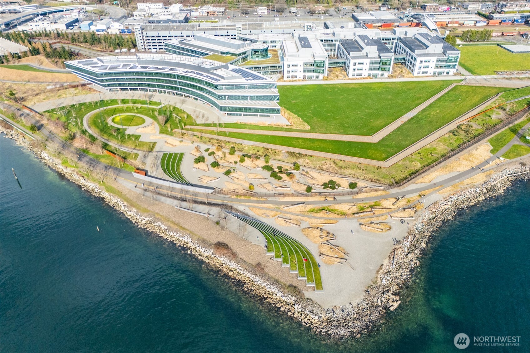 500 West Olympic Place, Unit 203 Seattle, WA 98119 - Photo 34 of 35 a view of swimming pool with a garden and seating area