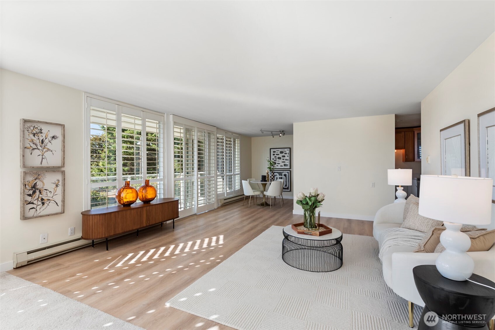 500 West Olympic Place, Unit 203 Seattle, WA 98119 - Photo 6 of 35 a living room with furniture and a potted plant