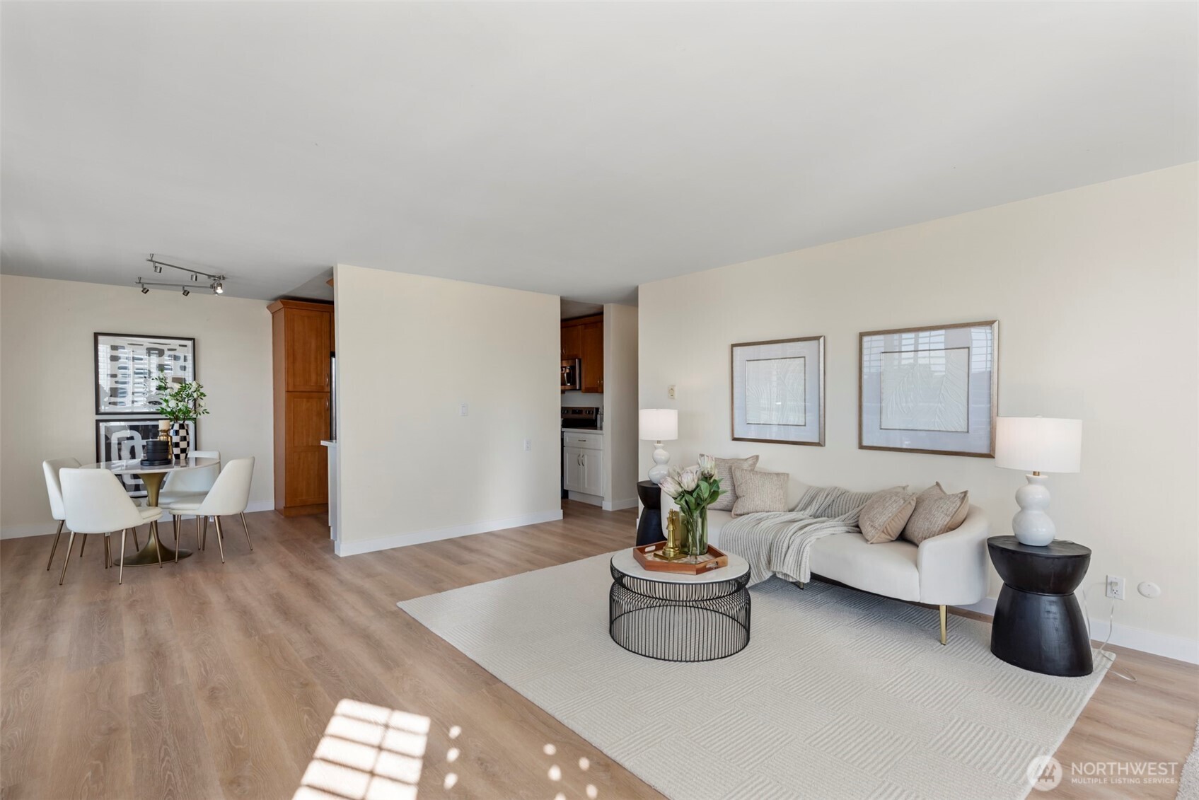 500 West Olympic Place, Unit 203 Seattle, WA 98119 - Photo 7 of 35 a living room with furniture and a wooden floor