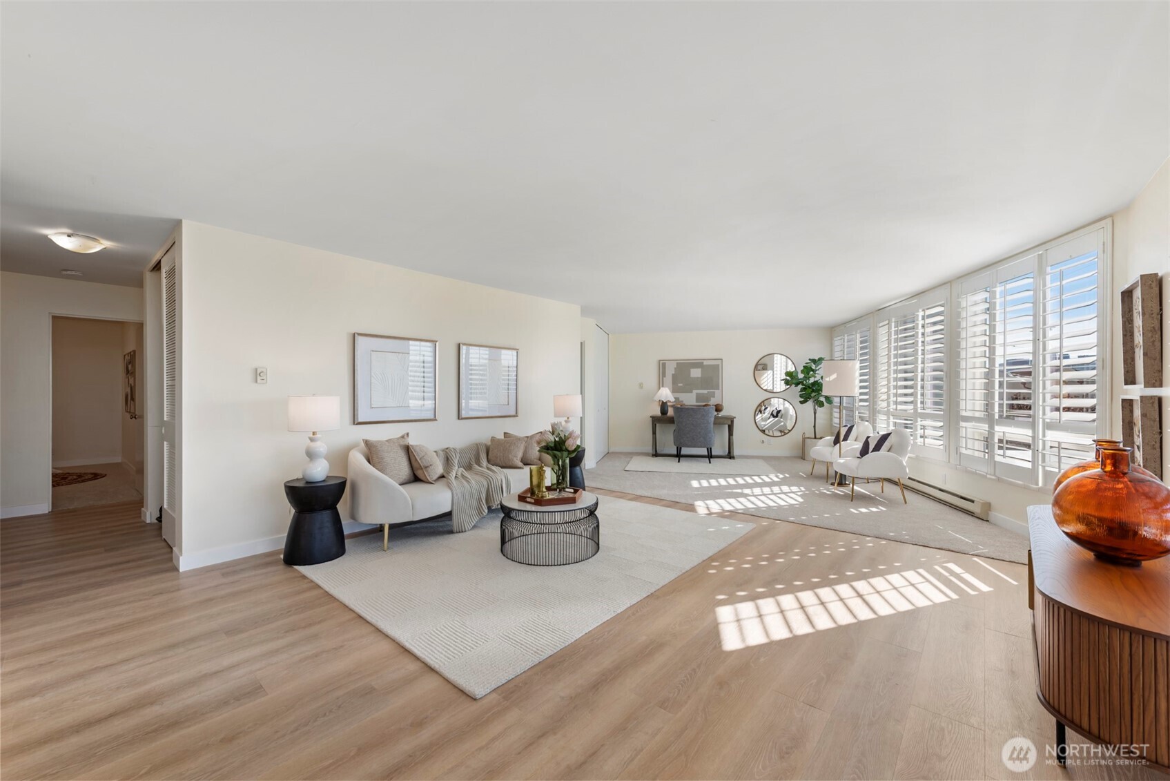 500 West Olympic Place, Unit 203 Seattle, WA 98119 - Photo 8 of 35 a living room with furniture and a large window