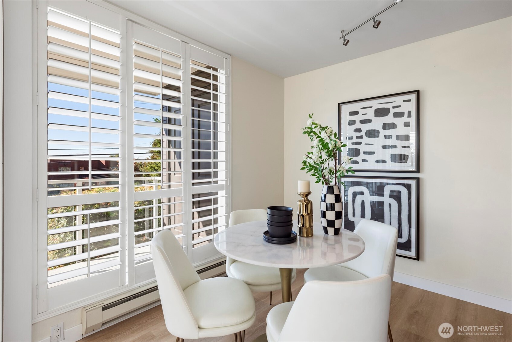 500 West Olympic Place, Unit 203 Seattle, WA 98119 - Photo 9 of 35 a view of a dining room with furniture and window